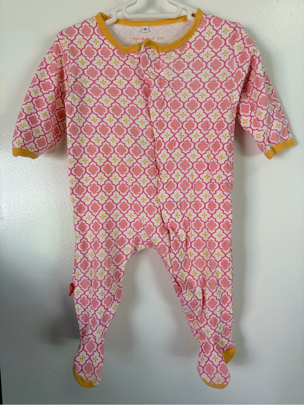 Magnificent Baby Pink Geometric Footed One-Piece with Yellow Trim